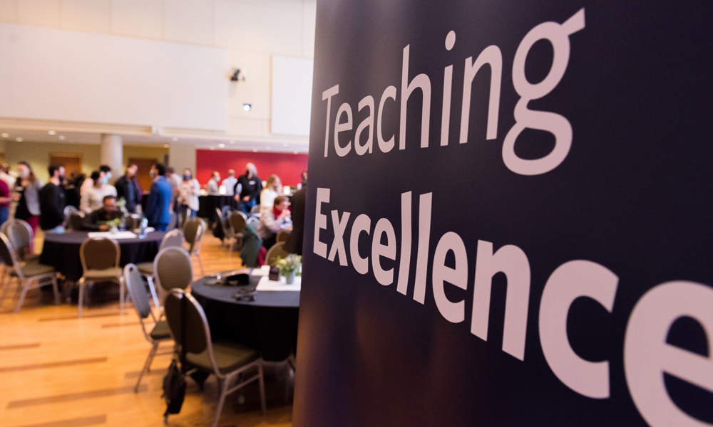 People celebrating the Teaching Excellence awards in the ballroom